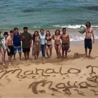 Group of students on a beach in Hawaii