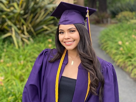 Karina Martinex wearing a graduation gown. 