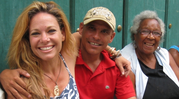 Altruvistas Malia Everette sitting along side Cuba people